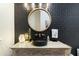 Modern bathroom with black vessel sink and patterned tile at 8802 E Rimrock Dr, Scottsdale, AZ 85255