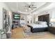Main bedroom with fireplace, large TV and sitting area at 8802 E Rimrock Dr, Scottsdale, AZ 85255