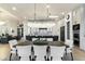 Modern dining room with large table and chandelier, open to kitchen at 8802 E Rimrock Dr, Scottsdale, AZ 85255