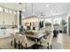 Bright dining room features a large wood table and modern chandelier at 8802 E Rimrock Dr, Scottsdale, AZ 85255