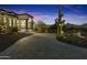 Front entrance with a curved driveway and desert landscaping at 8802 E Rimrock Dr, Scottsdale, AZ 85255