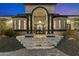 Elegant entryway with stone columns and arched entry at 8802 E Rimrock Dr, Scottsdale, AZ 85255