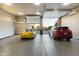 Large garage with high ceilings and room for multiple vehicles at 8802 E Rimrock Dr, Scottsdale, AZ 85255