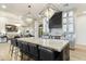 Spacious kitchen with large island, marble countertops, and modern pendant lights at 8802 E Rimrock Dr, Scottsdale, AZ 85255