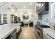 Modern kitchen features marble countertops, a farmhouse sink, and high-end appliances at 8802 E Rimrock Dr, Scottsdale, AZ 85255