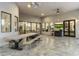 Covered patio with large wooden table, comfortable seating, and a TV at 8802 E Rimrock Dr, Scottsdale, AZ 85255