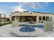 Private backyard pool and spa with a patio, outdoor seating, and mountain views at 8802 E Rimrock Dr, Scottsdale, AZ 85255