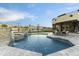 Relaxing pool and spa area with stone accents and a spacious patio at 8802 E Rimrock Dr, Scottsdale, AZ 85255