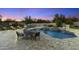Spacious backyard with pool, spa, lounge chairs, and sunset views at 8802 E Rimrock Dr, Scottsdale, AZ 85255