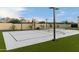 Private sports court with basketball hoop and tennis net, perfect for recreation at 8802 E Rimrock Dr, Scottsdale, AZ 85255