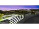 Elevated view of lighted sports court and mountain views at 8802 E Rimrock Dr, Scottsdale, AZ 85255