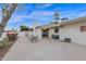 Backyard patio with pergola and seating area at 947 N 85Th Pl, Scottsdale, AZ 85257