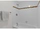 Bathroom with shower/tub combo and tile surround at 947 N 85Th Pl, Scottsdale, AZ 85257