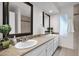 Bright bathroom boasts double sinks, large mirrors, and updated fixtures at 947 N 85Th Pl, Scottsdale, AZ 85257