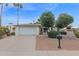 Charming single story home with a two car garage and desert landscaping at 947 N 85Th Pl, Scottsdale, AZ 85257