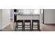 Kitchen features a breakfast bar and modern appliances at 947 N 85Th Pl, Scottsdale, AZ 85257