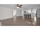 Open living room features tile floors and a kitchen with breakfast bar at 947 N 85Th Pl, Scottsdale, AZ 85257