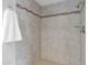 Clean shower with tile surround and neutral tones at 947 N 85Th Pl, Scottsdale, AZ 85257