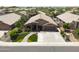 Single-story home with a two-car garage and lush landscaping at 10405 W Patrick Ln, Peoria, AZ 85383