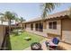 Large backyard with lawn, firepit and cornhole at 10405 W Patrick Ln, Peoria, AZ 85383