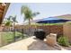 Backyard with grill, patio, and grassy area at 10405 W Patrick Ln, Peoria, AZ 85383