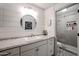 Bathroom with granite countertop and walk-in shower at 10405 W Patrick Ln, Peoria, AZ 85383