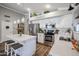 Modern kitchen with white shaker cabinets, stainless steel appliances, and a large island at 10405 W Patrick Ln, Peoria, AZ 85383