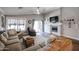 Spacious living room with fireplace and wood floors at 10405 W Patrick Ln, Peoria, AZ 85383