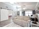 Spacious living room featuring hardwood floors and sliding glass doors at 10405 W Patrick Ln, Peoria, AZ 85383