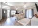 Bright living room with hardwood floors, recessed lighting, and a comfy sofa at 10405 W Patrick Ln, Peoria, AZ 85383