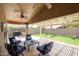 Relaxing patio with seating area, pergola, and views of the backyard at 10405 W Patrick Ln, Peoria, AZ 85383