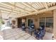 Spacious patio with pergola, seating area, and string lights at 10405 W Patrick Ln, Peoria, AZ 85383