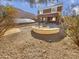 Backyard with fire pit and solar panels at 11436 W Austin Thomas Dr, Surprise, AZ 85378