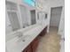 Bathroom with double sinks, a tub, and a separate shower at 11436 W Austin Thomas Dr, Surprise, AZ 85378