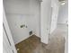 Small laundry room with built-in shelving at 11436 W Austin Thomas Dr, Surprise, AZ 85378
