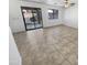 Living area with tile floors and sliding glass doors at 11436 W Austin Thomas Dr, Surprise, AZ 85378
