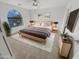 Bright bedroom with a large window and wooden bed frame at 11436 W Austin Thomas Dr, Surprise, AZ 85378