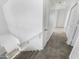 Upstairs hallway with carpeted flooring and access to bedrooms at 11436 W Austin Thomas Dr, Surprise, AZ 85378