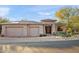 Two-story home with a two-car garage and desert landscaping at 12544 N 120Th Pl, Scottsdale, AZ 85259