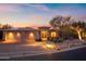 Beautiful desert home with a three-car garage and landscaped yard at sunset at 12544 N 120Th Pl, Scottsdale, AZ 85259