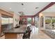 Gourmet kitchen with island seating and access to outdoor patio at 12544 N 120Th Pl, Scottsdale, AZ 85259