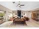 Living room with fireplace and access to the backyard at 12544 N 120Th Pl, Scottsdale, AZ 85259
