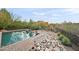 Refreshing pool with attractive landscaping and rock features at 12544 N 120Th Pl, Scottsdale, AZ 85259