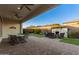 Relaxing backyard oasis with covered patio, fireplace, and seating area at 13162 W Duane Ln, Peoria, AZ 85383