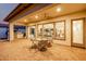 Covered patio with seating area and views of the kitchen at 13162 W Duane Ln, Peoria, AZ 85383