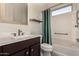 Bathroom with tub, shower, single vanity, and window at 13162 W Duane Ln, Peoria, AZ 85383