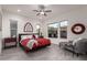 Spacious bedroom with red bedding and large windows at 13162 W Duane Ln, Peoria, AZ 85383