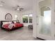 Spacious bedroom with red bedding and large windows at 13162 W Duane Ln, Peoria, AZ 85383