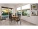 Bright dining area with wood table and sliding glass doors at 13162 W Duane Ln, Peoria, AZ 85383