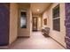 Inviting entryway with a metal door and a bench at 13162 W Duane Ln, Peoria, AZ 85383